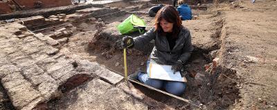 A volunteer taking part in Tennant Square's archaeological dig