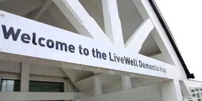 Pic of LiveWell Dementia Hub sign on outside of building