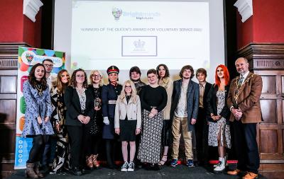 Members of Bright Minds Big Futures are presented with the Queen's Award