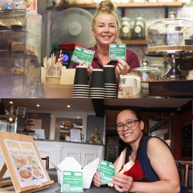 Staff at two greener businesses in Stockton-on-Tees, Tuk Tuk and Remember me Tearooms holding their greener business stickers after signing up. 