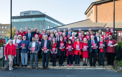 SBC councillors stood together holding Show Racism the Red Card posters